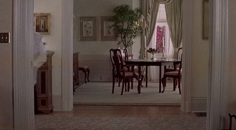Mrs. Doubtfire dancing with a broom